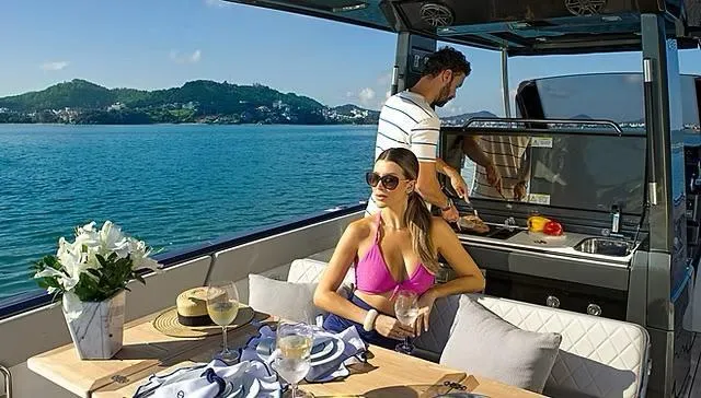 Slide: The Image of Couple enjoying leisure time on Schaefer V33 yacht, 2025 model, with scenic ocean view. - 35