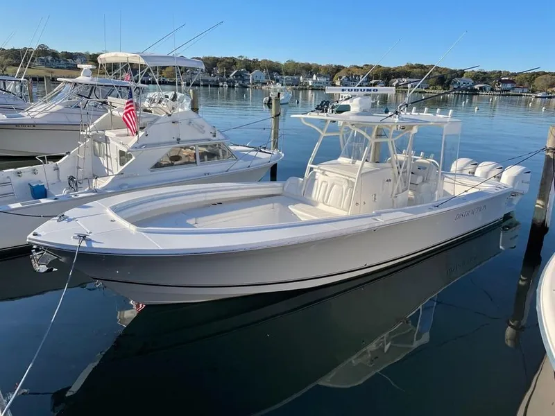 Slide: The Image of Aerial view of 2019 Regulator 34SS boat cruising on dark water. - 14