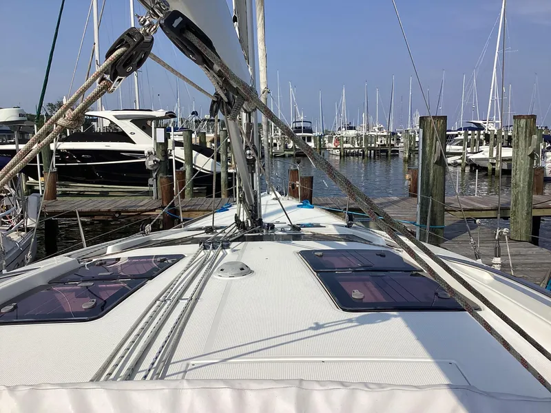 Slide: The Image of Sailboat Bavaria Vision 46, 2012 model, docked at marina with other boats. - 3