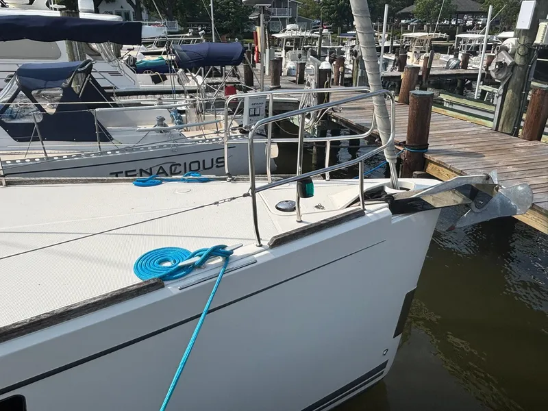Slide: The Image of Bavaria Vision 46 sailboat docked, featuring a sleek design and vibrant blue rope. - 4