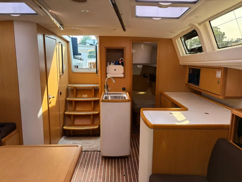 Slide: The Image of Interior of 2012 Bavaria Vision 46 yacht with modern wood finish and compact kitchen. - 6