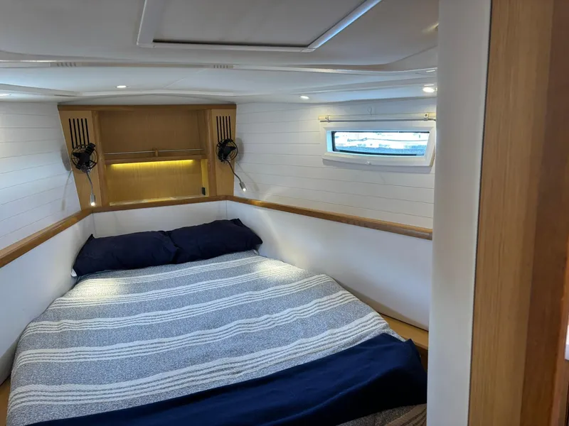Slide: The Image of Cozy cabin interior of 2012 Bavaria Vision 46 yacht with bed and window. - 7