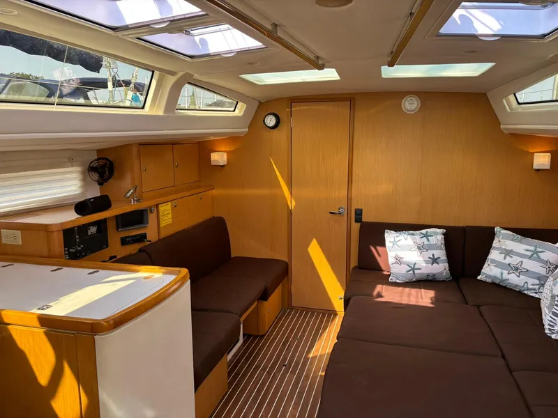 Slide: The Image of Luxurious interior of 2012 Bavaria Vision 46 yacht with plush seating and ample natural light. - 8
