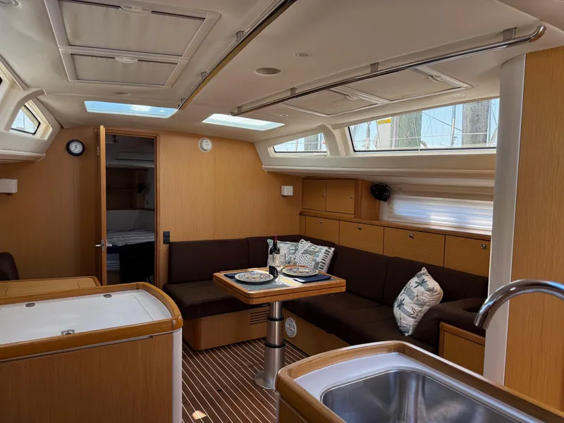 Slide: The Image of Interior of 2012 Bavaria Vision 46 yacht with cozy seating and dining area. - 9