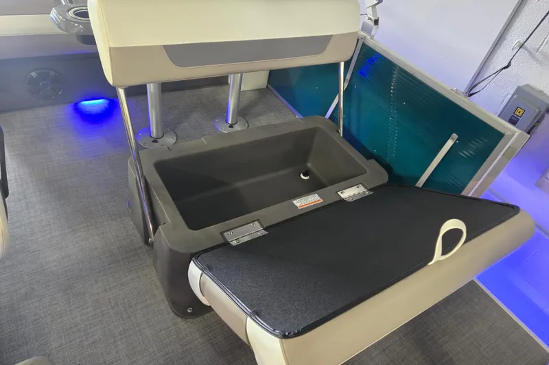 Slide: The Image of 2025 Princecraft Vectra 23 RL boat seat with storage compartment, illuminated by blue LED lights. - 15
