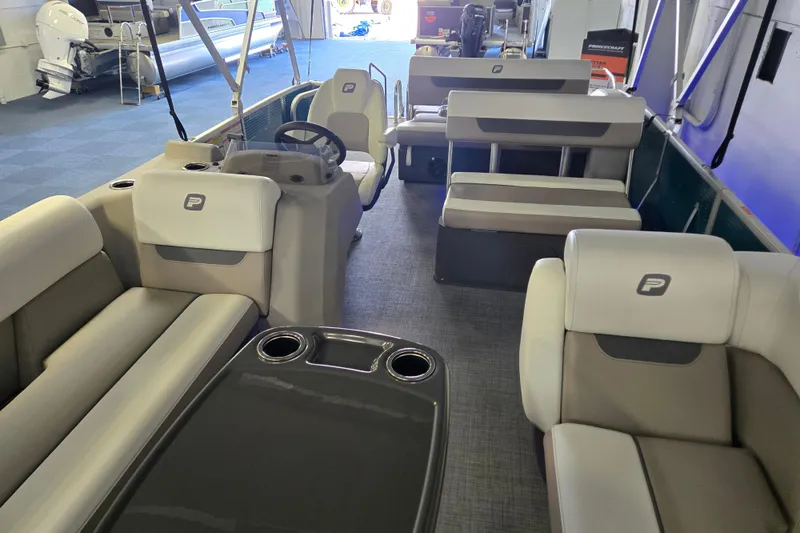 Slide: The Image of 2025 Princecraft Vectra 23 RL pontoon boat interior with plush seating and modern design. - 16