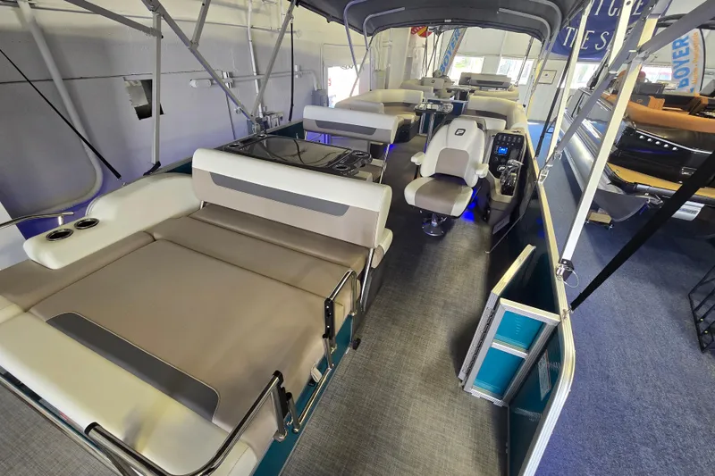 Slide: The Image of 2025 Princecraft Vectra 23 RL pontoon boat interior with seating and helm station. - 18