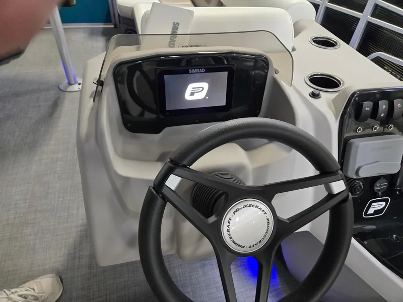 Slide: The Image of 2025 Princecraft Vectra 23 RL dashboard with steering wheel and digital display. - 3