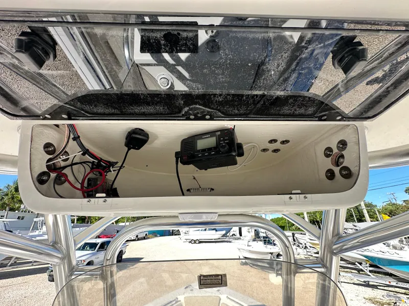Slide: The Image of 2025 Key West 239 FS boat console with electronic equipment and wiring. - 16