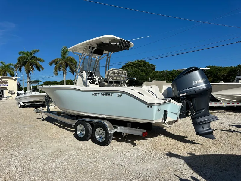 Slide: The Image of 2025 Key West 239 FS boat with Yamaha engine on trailer, parked outdoors. - 3