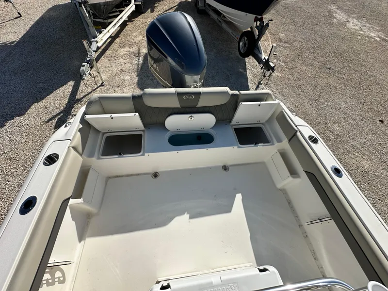 Slide: The Image of 2025 Key West 239 FS boat interior with seating and storage compartments. - 7