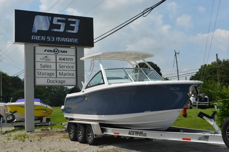 The Image of 2026 Blackfin 252 DC boat on trailer at Pier 53 Marine dealership. - 0