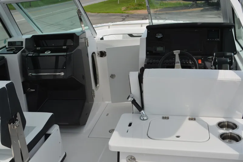 Slide: The Image of 2026 Blackfin 252 DC boat interior with helm, seating, and control panel. - 14