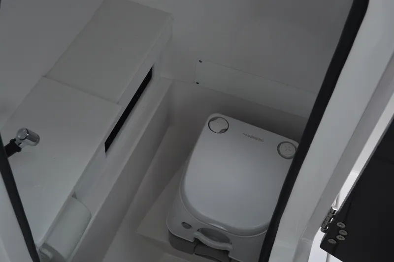Slide: The Image of 2026 Blackfin 252 DC boat interior with compact marine toilet. - 16