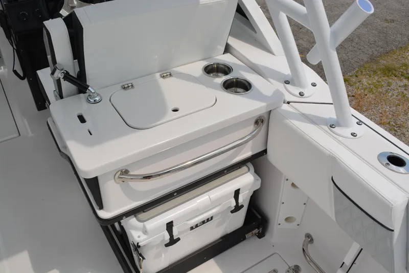 Slide: The Image of 2026 Blackfin 252 DC boat interior with sink, cup holders, and storage area. - 24