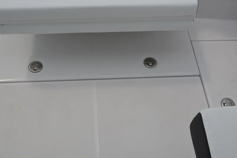 Slide: The Image of 2026 Blackfin 252 DC boat deck with sleek, modern design and stainless steel fixtures. - 25