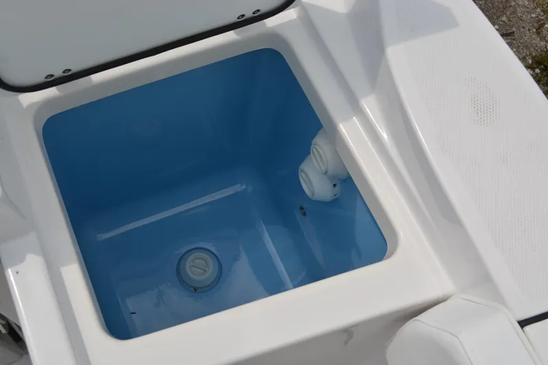Slide: The Image of Livewell compartment on a 2026 Blackfin 252 DC boat, featuring a blue interior. - 27