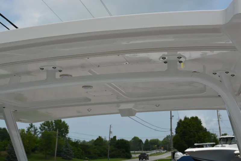 Slide: The Image of 2026 Blackfin 252 DC boat hardtop with scenic background. - 30