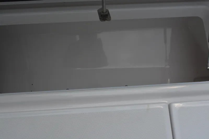 Slide: The Image of Open storage compartment on a 2026 Blackfin 252 DC boat. - 31