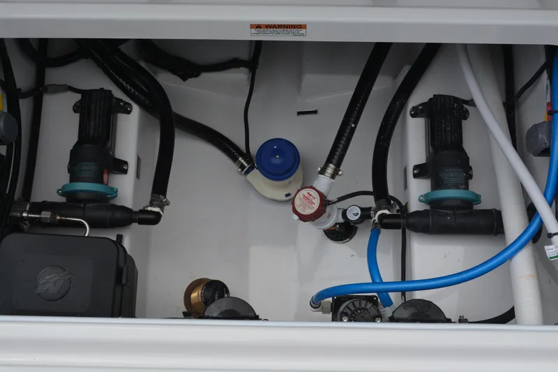 Slide: The Image of 2026 Blackfin 252 DC boat engine compartment with pumps and hoses. - 36
