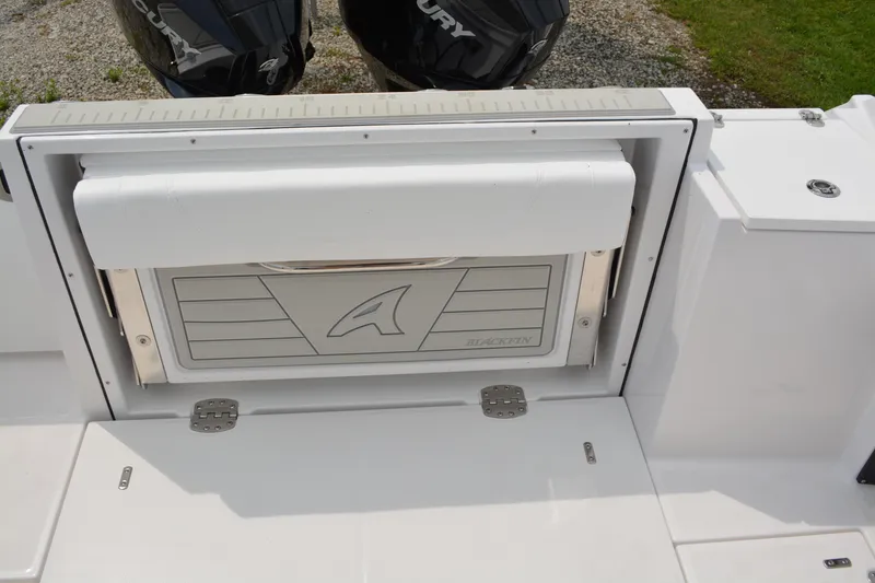 Slide: The Image of 2026 Blackfin 252 DC boat with Mercury engines, featuring a sleek, modern design. - 37