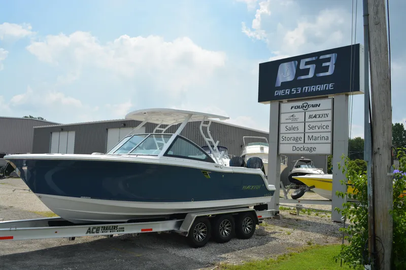 Slide: The Image of 2026 Blackfin 252 DC boat on trailer at Pier 53 Marine dealership. - 6