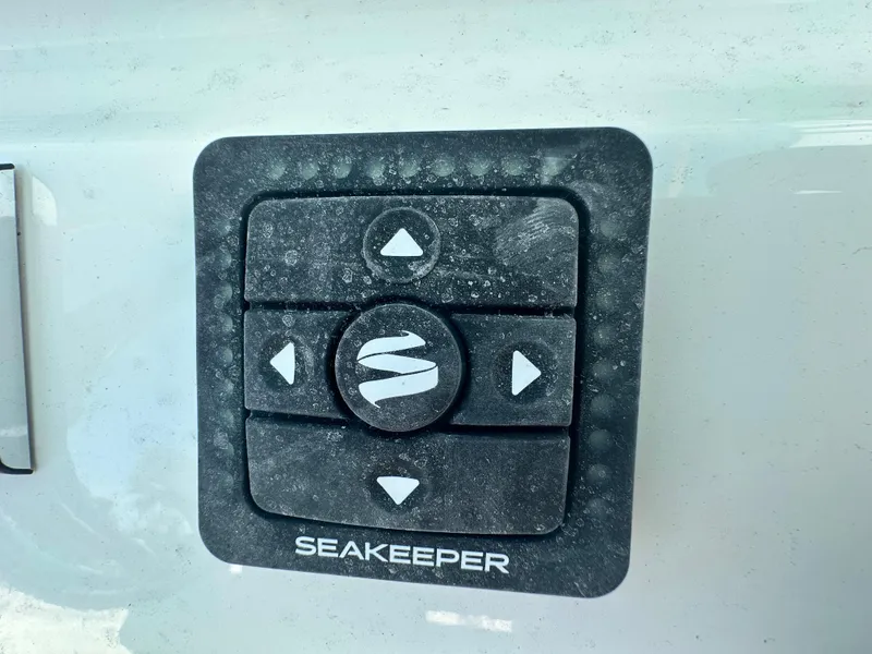 Slide: The Image of Control panel on a 2025 Key West 263 FS boat, featuring Seakeeper stabilization. - 15