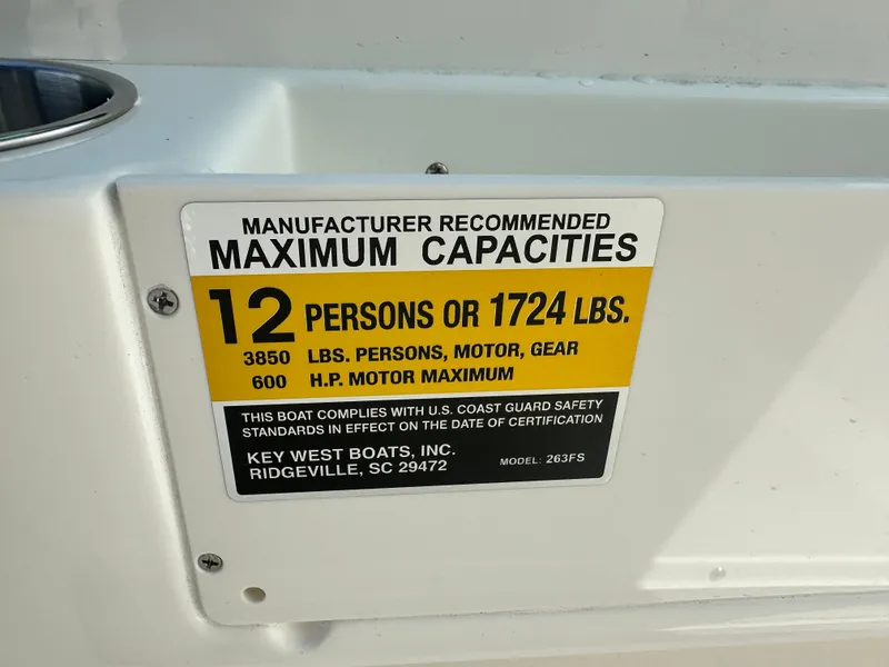 Slide: The Image of 2025 Key West 263 FS capacity label, 12 persons or 1724 lbs, 600 HP motor maximum. - 19