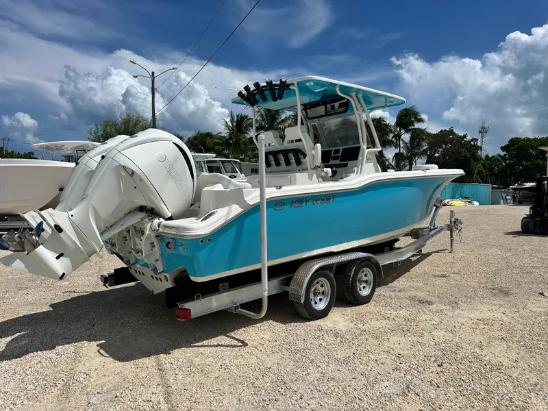 Slide: The Image of 2025 Key West 263 FS boat on trailer, featuring Yamaha outboard motor, under a partly cloudy sky. - 3
