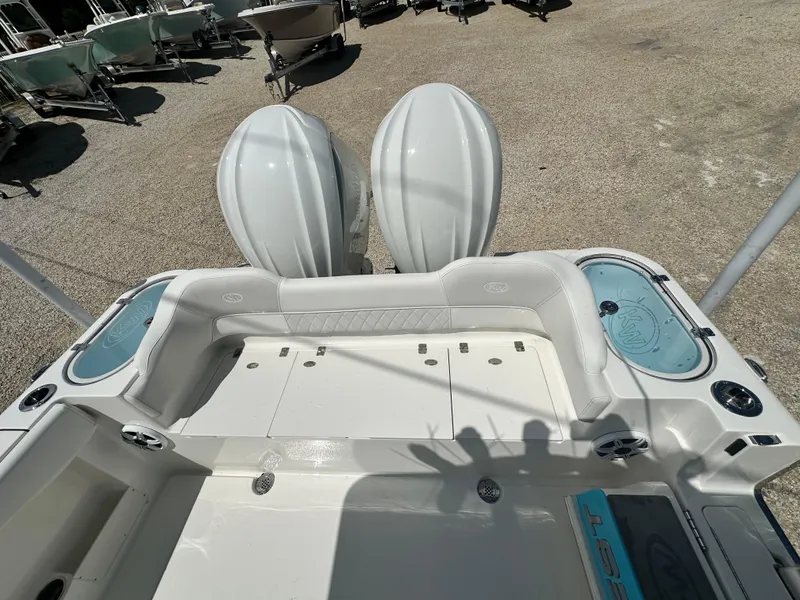 Slide: The Image of 2025 Key West 263 FS boat interior with dual engines and seating area. - 7