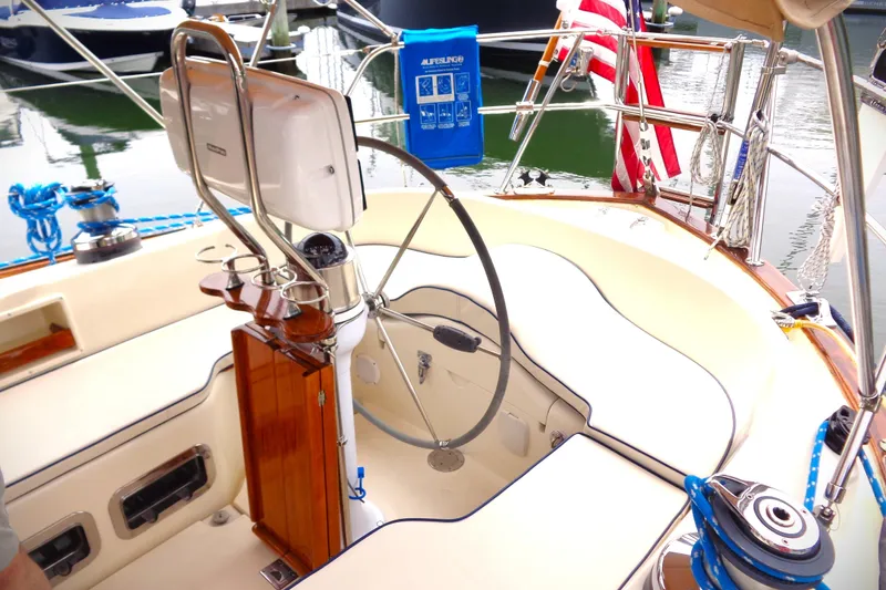 Slide: The Image of Cockpit of 2005 Pacific Seacraft 40 sailboat with steering wheel and navigation equipment. - 9