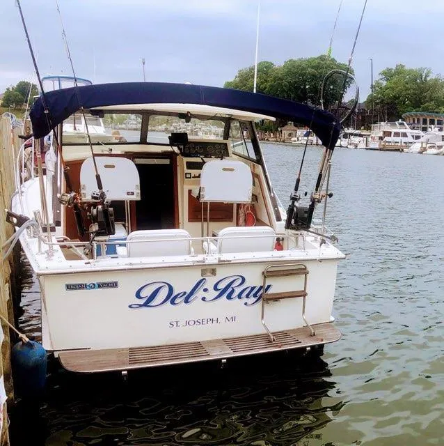 Slide: The Image of 1977 Trojan F30 Express boat "Del Ray" docked in St. Joseph, MI marina. - 2