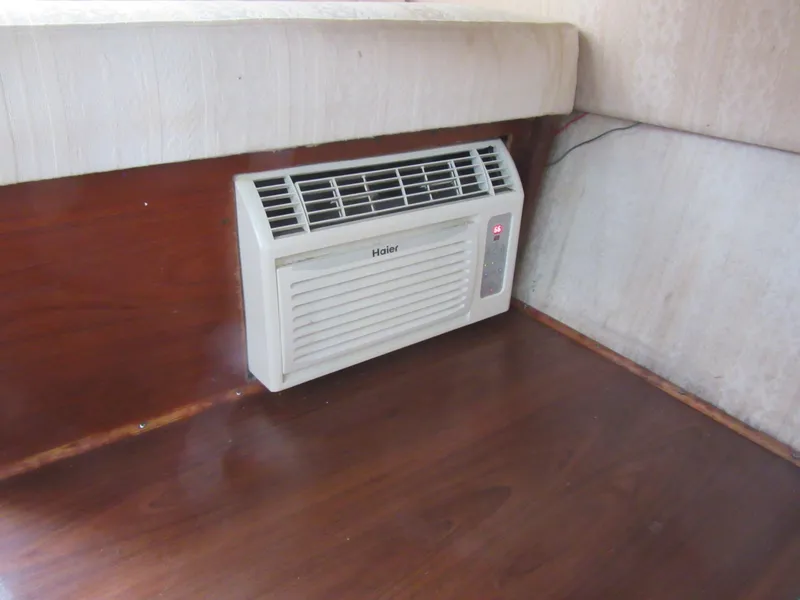 Slide: The Image of Air conditioner installed in a 1977 Trojan F30 Express boat interior. - 28