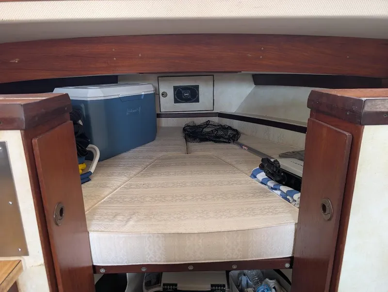 Slide: The Image of 1977 Trojan F30 Express cabin interior with storage and cooler. - 33