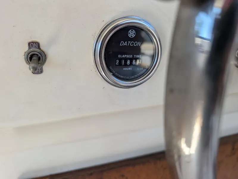 Slide: The Image of 1977 Trojan F30 Express dashboard with Datcon hour meter showing 2166.4 hours. - 35