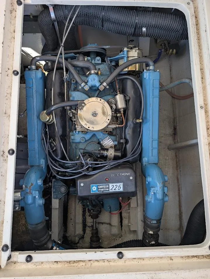 Slide: The Image of 1977 Trojan F30 Express engine compartment with Chrysler Marine 225 engine. - 36