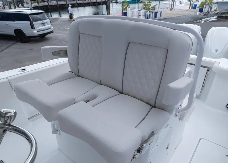 Slide: The Image of 2026 Sea Hunt Gamefish 27 Coffin Box boat seating, featuring plush, diamond-stitched upholstery. - 12