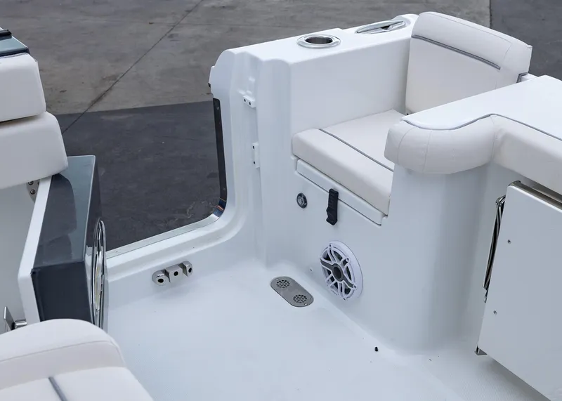 Slide: The Image of 2026 Sea Hunt Gamefish 27 Coffin Box boat interior with white seating and cup holders. - 17
