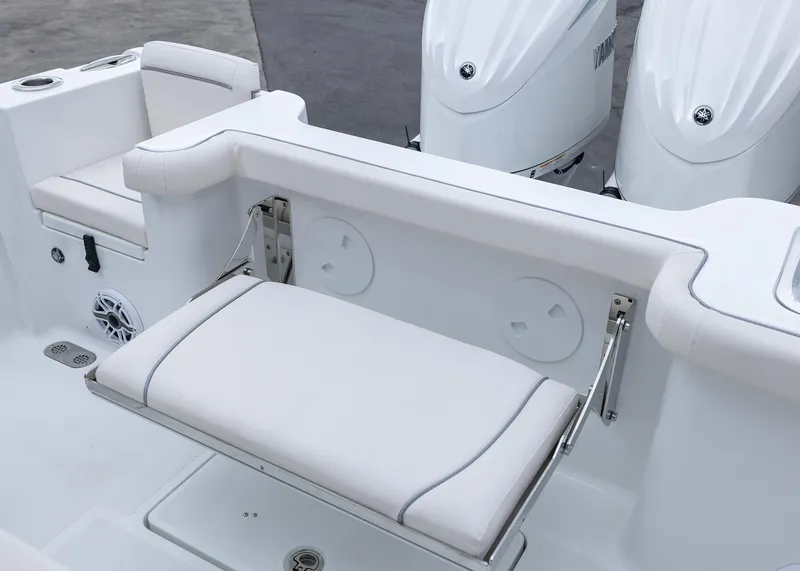 Slide: The Image of 2026 Sea Hunt Gamefish 27 Coffin Box boat interior with foldable seating and dual engines. - 18