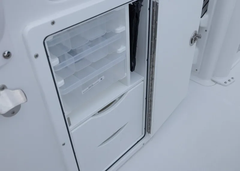 Slide: The Image of Storage compartment on 2026 Sea Hunt Gamefish 27 Coffin Box boat, featuring organized drawers. - 24