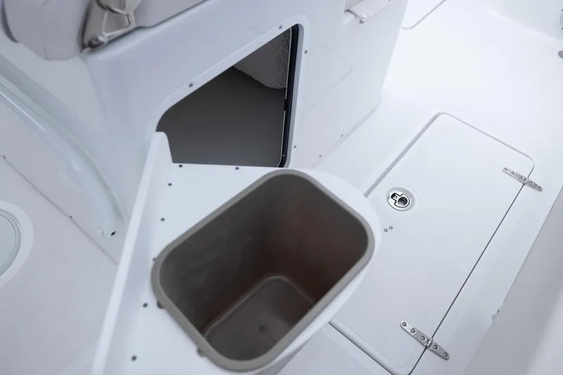 Slide: The Image of Interior of 2026 Sea Hunt Gamefish 27 Coffin Box, featuring storage compartments and seating. - 27