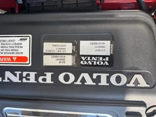 Slide: The Image of Volvo Penta engine cover on a 2006 Cobalt 220 boat. - 12