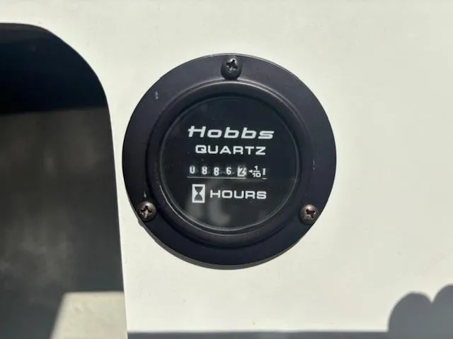Slide: The Image of Hobbs Quartz hour meter displaying 886.2 hours on a 2006 Cobalt 220. - 5