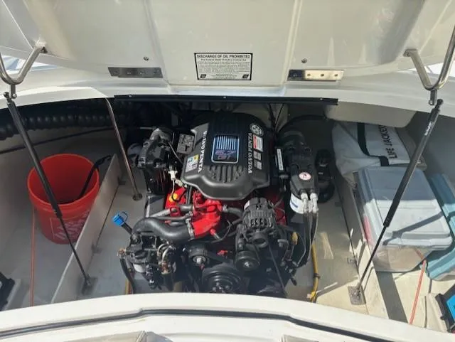 Slide: The Image of Engine compartment of a 2006 Cobalt 220 boat, featuring a well-maintained motor. - 7