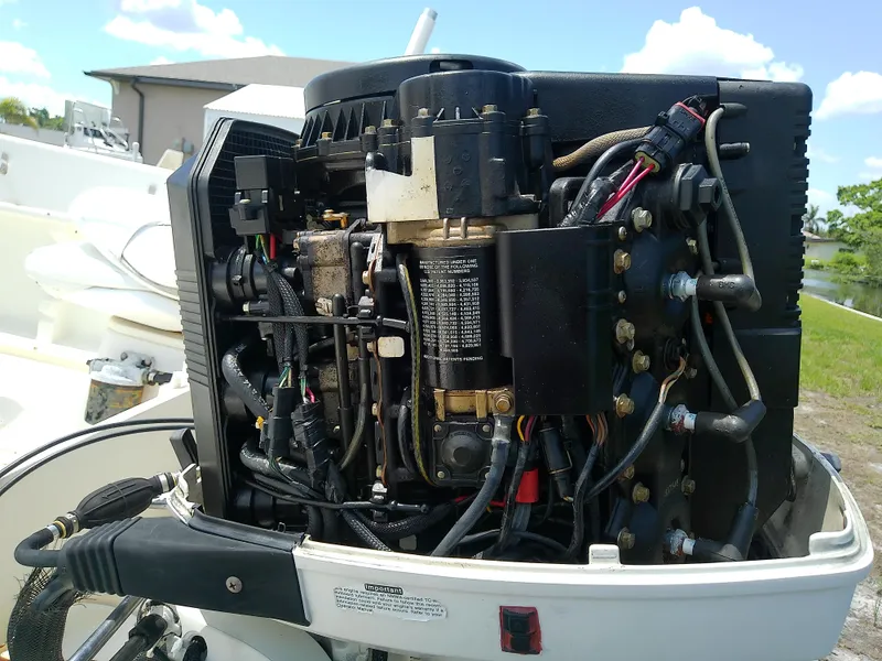 Slide: The Image of Close-up of a 2000 Hydra-Sports 212 Seahorse CC boat engine, showcasing intricate wiring. - 10