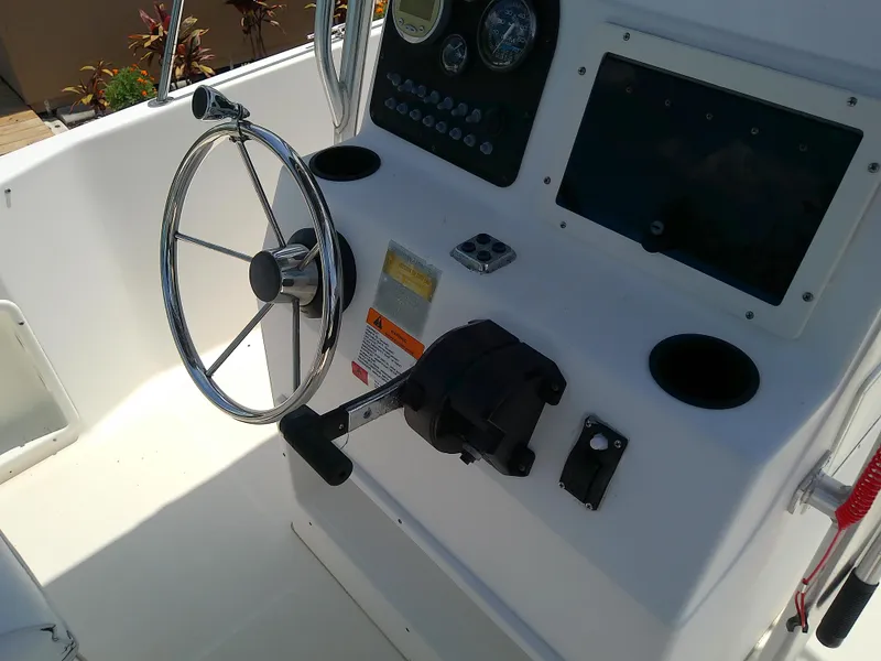 Slide: The Image of Steering console of 2000 Hydra-Sports 212 Seahorse CC boat with controls and gauges. - 19