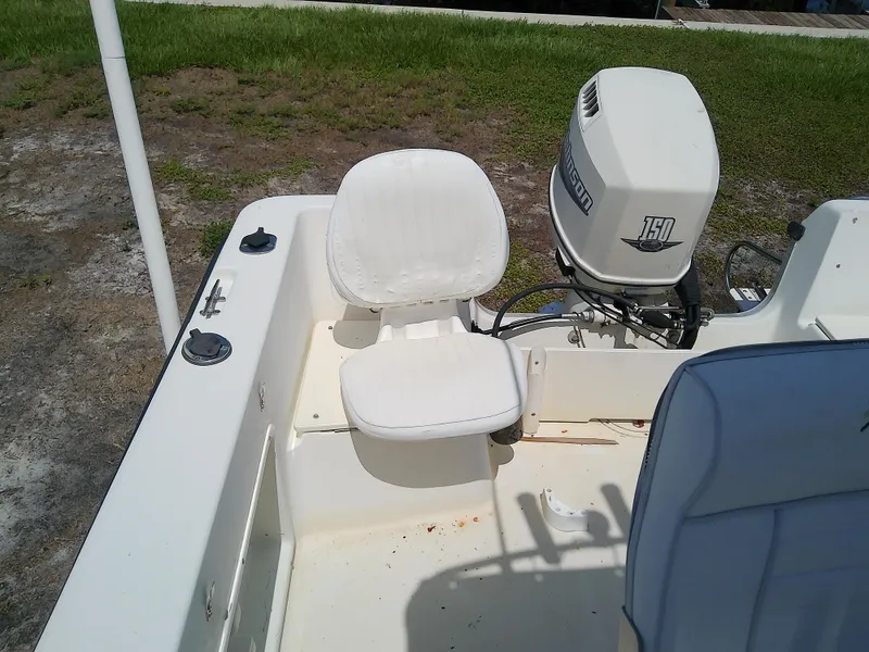 Slide: The Image of 2000 Hydra-Sports 212 Seahorse CC boat with white seating and Johnson 150 outboard motor. - 20