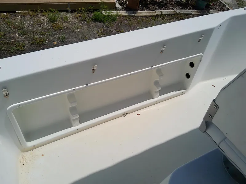 Slide: The Image of 2000 Hydra-Sports 212 Seahorse CC boat interior detail, showing storage compartment. - 24