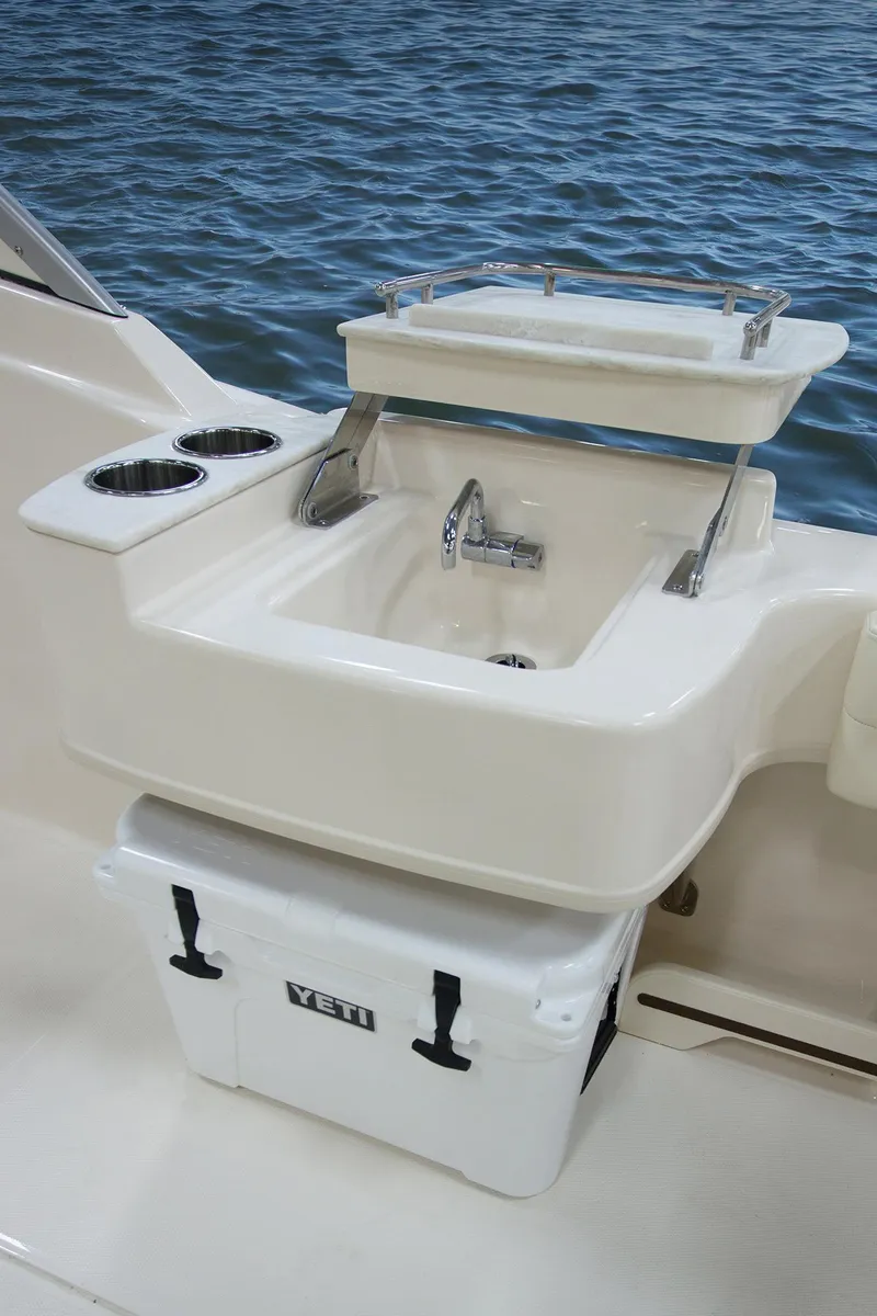 Slide: The Image of Boat sink and cooler on 2026 Grady-White GW 235 Freedom, with ocean background. - 8