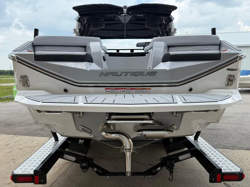 Slide: The Image of 2025 Nautique Super Air Nautique G23 boat rear view on trailer. - 16